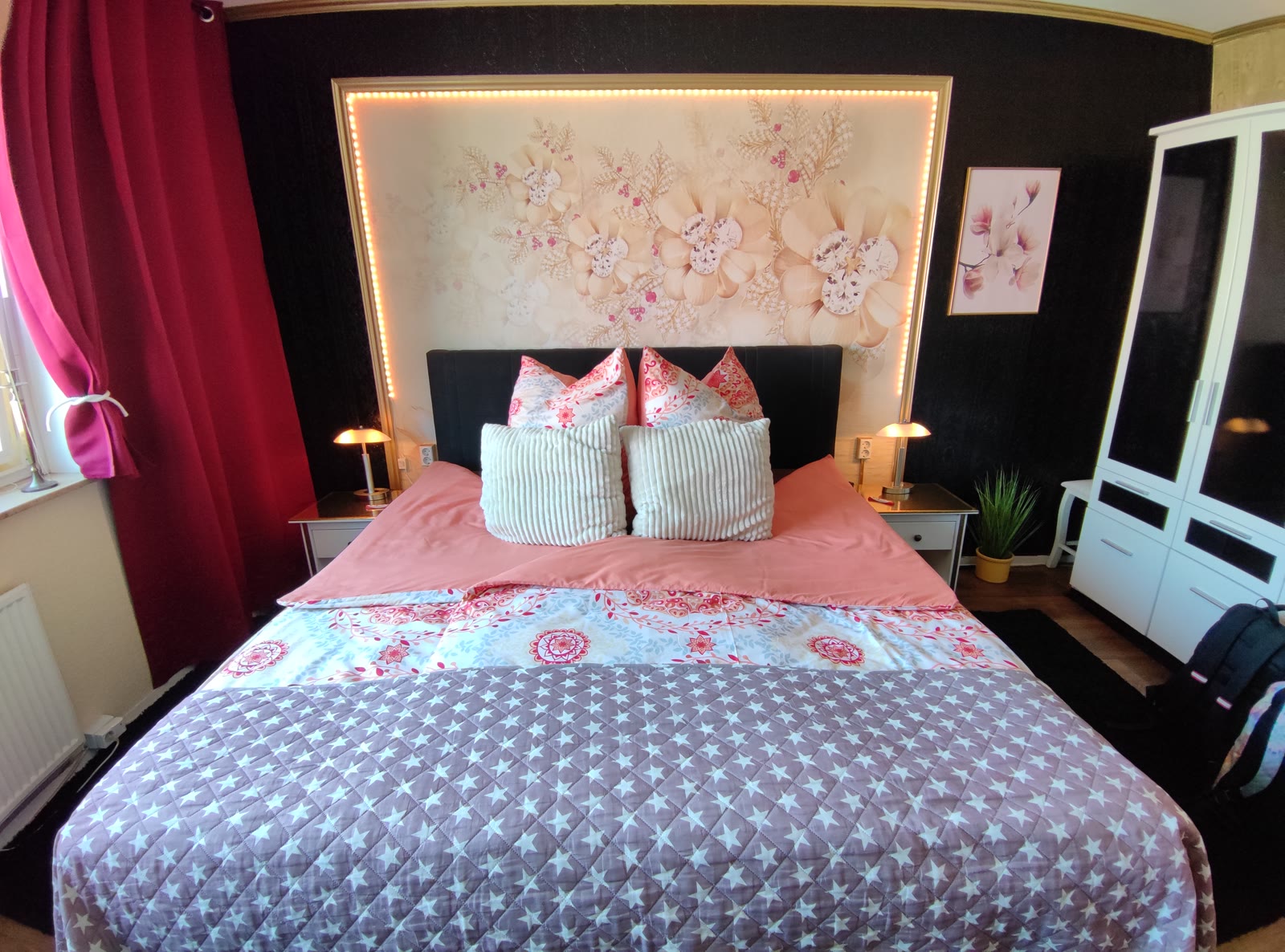 A hotel room in Hamburg with a double bed and two bedside lamps, photographed by How to Gluten Free
